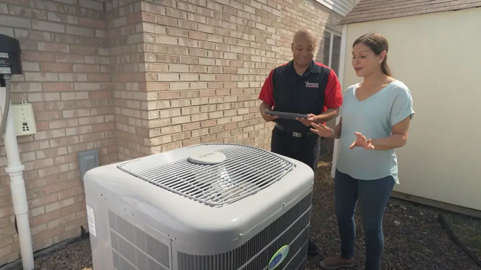 King Heating technician performing an AC tune-up in Oak Forest, IL