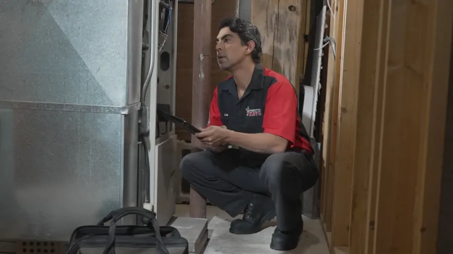 A King technician repairing a furnace